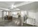 Spacious living and kitchen area with modern bar stools and bright, open floor plan at 905 Juniper Ne St # 110, Atlanta, GA 30309