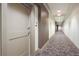 Interior hallway featuring neutral carpet and paint throughout the building at 905 Juniper Ne St # 110, Atlanta, GA 30309