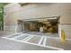 Entrance to the building's parking garage, showing entry clearance and access control at 905 Juniper Ne St # 110, Atlanta, GA 30309