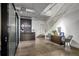 Bright reception area featuring a modern desk, stylish seating, and an open staircase leading to the upper level at 905 Juniper Ne St # 110, Atlanta, GA 30309
