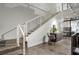 Contemporary staircase with white railings and polished floors, complemented by stylish decor and natural light at 905 Juniper Ne St # 110, Atlanta, GA 30309