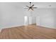 Large bedroom with hardwood floors, vaulted ceiling, and a ceiling fan at 9645 Dunhill Way, Cumming, GA 30028