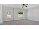 Inviting bedroom with neutral carpet, ample natural light, and a ceiling fan at 9645 Dunhill Way, Cumming, GA 30028