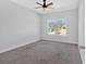 Clean, bright bedroom with neutral carpeting and neighborhood views at 9645 Dunhill Way, Cumming, GA 30028