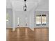 Bright foyer featuring hardwood floors, large windows, and a white front door allowing ample natural light at 9645 Dunhill Way, Cumming, GA 30028