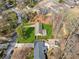 This aerial shows the property and mature trees in the surrounding neighborhood at 2264 Winding Way, Tucker, GA 30084