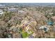 This aerial view showcases the neighborhood with mature trees and the proximity to shopping and offices at 2264 Winding Way, Tucker, GA 30084