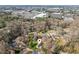 An aerial view showcases the home nestled within a serene, tree-lined neighborhood at 2264 Winding Way, Tucker, GA 30084