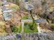 Aerial view of home and surrounding manicured lawn and neighborhood, showcasing backyard at 2264 Winding Way, Tucker, GA 30084
