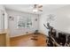 Bedroom featuring exercise equipment, hardwood floors, natural light and an overhead fan at 2264 Winding Way, Tucker, GA 30084