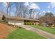 Charming single-story home with a well-maintained lawn, driveway, and a two-car garage at 2264 Winding Way, Tucker, GA 30084