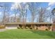 Traditional brick home with well-maintained front yard, mature shrubbery, and a two-car garage at 2264 Winding Way, Tucker, GA 30084