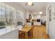 Bright kitchen with a breakfast nook, white cabinets, hardwood floors, and stainless steel appliances at 2264 Winding Way, Tucker, GA 30084
