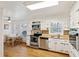 Well-lit kitchen featuring stainless steel appliances, wood-look countertops and hardwood floors at 2264 Winding Way, Tucker, GA 30084