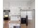 Kitchen area featuring stainless steel refrigerator, granite countertops, and white cabinets, and hardwood floors at 2264 Winding Way, Tucker, GA 30084