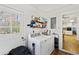 Laundry room equipped with a washer, a dryer, and ample storage space at 2264 Winding Way, Tucker, GA 30084