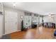 Bright and airy living room with hardwood floors, adjacent dining area, and large windows for natural light at 2264 Winding Way, Tucker, GA 30084