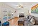 Comfortable living room with hardwood floors, gray sofa and double doors leading to the back yard at 2264 Winding Way, Tucker, GA 30084