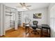 Office space with hardwood floors, a ceiling fan, and built-in shelving for storage at 2264 Winding Way, Tucker, GA 30084