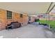 Spacious covered patio, perfect for entertaining, adjoins the brick home and has views of the private backyard at 2264 Winding Way, Tucker, GA 30084