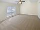Bedroom featuring neutral carpet, a ceiling fan and natural light at 3705 Tradewinds Dr, Cumming, GA 30041