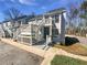 Charming townhouse with beautiful white trim, painted siding and wood stairs at 3705 Tradewinds Dr, Cumming, GA 30041