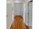 Hallway features hardwood floors, white walls, and updated trim at 3705 Tradewinds Dr, Cumming, GA 30041