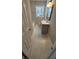 Well-lit bathroom featuring modern vanity, a window, and attractive marble-look tile flooring at 4715 Greensprings Rd, College Park, GA 30337