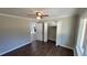 Bright bedroom features a ceiling fan, hardwood floors and a spacious closet at 4715 Greensprings Rd, College Park, GA 30337