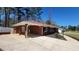 Charming brick home featuring a well-manicured lawn and a convenient carport at 4715 Greensprings Rd, College Park, GA 30337