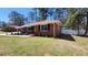 Beautifully landscaped lawn with a classic brick home at 4715 Greensprings Rd, College Park, GA 30337
