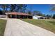 Lovely home with an expansive driveway leading to a convenient carport at 4715 Greensprings Rd, College Park, GA 30337