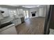 Modern kitchen features white cabinets, granite countertops, and stainless steel appliances at 4715 Greensprings Rd, College Park, GA 30337