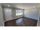 Cozy living room features hardwood floors and ample natural light at 4715 Greensprings Rd, College Park, GA 30337