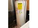 Image of the hot water heater with warning labels at 475 Maxwell Rd, Roswell, GA 30075