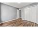 Neutral Bedroom with modern flooring, closet and entrance to hallway at 113 Willow Hill Ln, Stockbridge, GA 30281