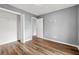 Spacious bedroom with gray walls, new floors, closet and entrance to another room at 113 Willow Hill Ln, Stockbridge, GA 30281