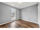 Cozy bedroom with ample natural light, new window, and light gray walls at 113 Willow Hill Ln, Stockbridge, GA 30281