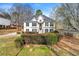 Charming two-story home with a well-maintained lawn and inviting front entrance and black shutters at 113 Willow Hill Ln, Stockbridge, GA 30281