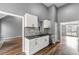 Modern kitchen features white cabinets, granite countertops, and stainless steel appliances at 113 Willow Hill Ln, Stockbridge, GA 30281