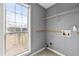 Laundry room with a window for natural light and utility hookups at 113 Willow Hill Ln, Stockbridge, GA 30281