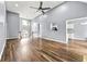 Spacious living room with wood-look floors, soaring ceiling, and a staircase at 113 Willow Hill Ln, Stockbridge, GA 30281