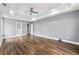 Large main bedroom with a tray ceiling, ceiling fan and new flooring at 113 Willow Hill Ln, Stockbridge, GA 30281