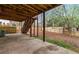 Covered patio with stairs to the backyard, fenced yard and some landscaping at 113 Willow Hill Ln, Stockbridge, GA 30281