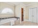 Elegant bathroom with soaking tub, decorative tile, and bright lighting at 19 Troup Ct, Acworth, GA 30101