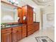 Elegant bathroom featuring double vanity with granite countertop and decorative tile at 19 Troup Ct, Acworth, GA 30101