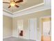 Bedroom with light-colored walls, carpet flooring, ceiling fan and access to bathroom and closet at 19 Troup Ct, Acworth, GA 30101