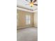 Bedroom with light-colored walls, carpet flooring, crown molding and windows with shutter blinds at 19 Troup Ct, Acworth, GA 30101