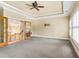 Open bedroom with light-colored walls, carpet flooring, fan and crown molding ceiling detail at 19 Troup Ct, Acworth, GA 30101