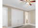 Bedroom with carpet and fan features french doors and neutral paint at 19 Troup Ct, Acworth, GA 30101
